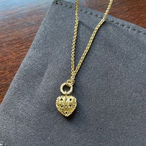 John Hardy 18K gold heart pendant with classic chain. Never been worn.